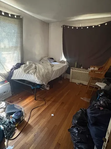 a bed room with a bed and a television