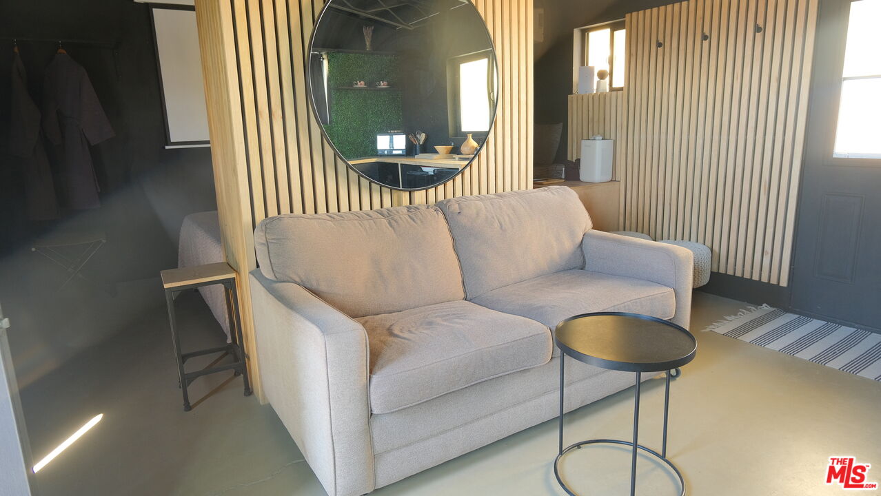 4351 Meriwether Road Twentynine Palms, CA 92277 - Photo 13 of 28 a living room with furniture and a large window
