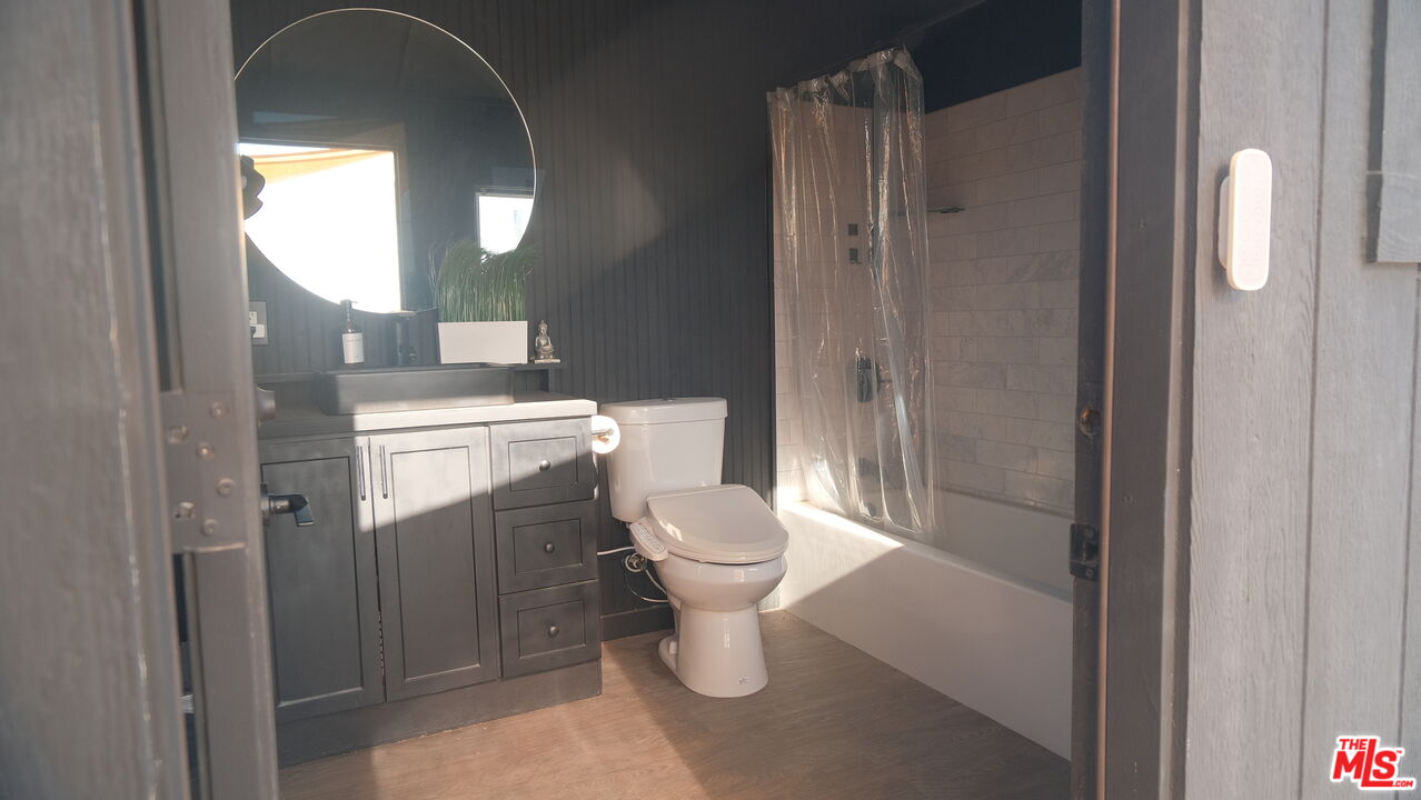 4351 Meriwether Road Twentynine Palms, CA 92277 - Photo 16 of 28 a bathroom with a toilet a sink and shower