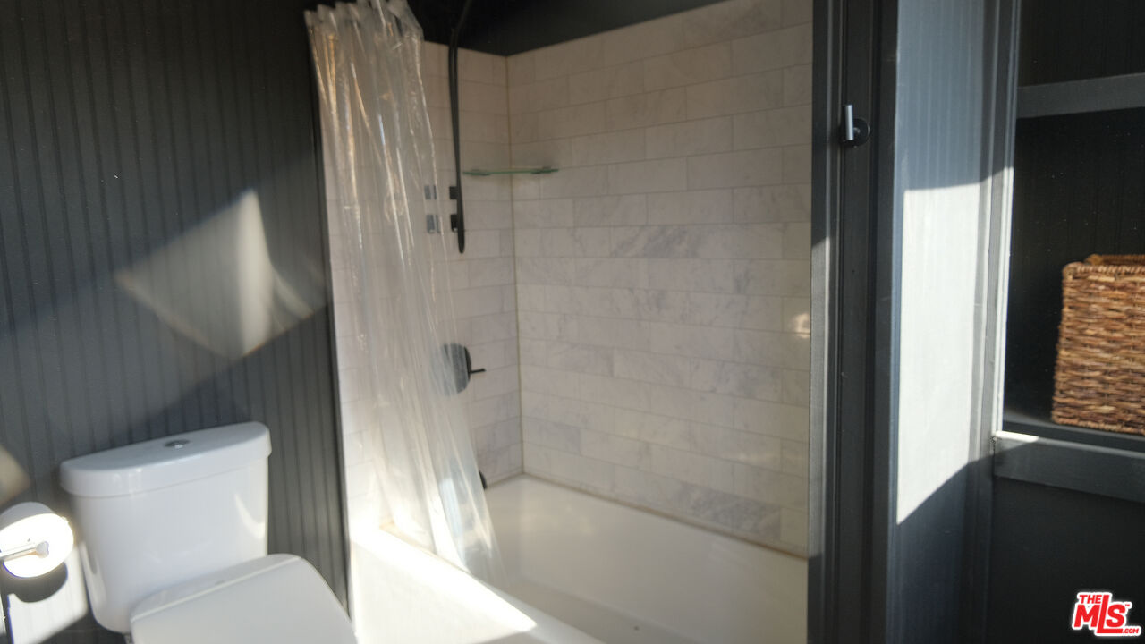 4351 Meriwether Road Twentynine Palms, CA 92277 - Photo 17 of 28 a bathroom with a toilet and a shower