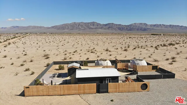 a terrace with a table and chairs