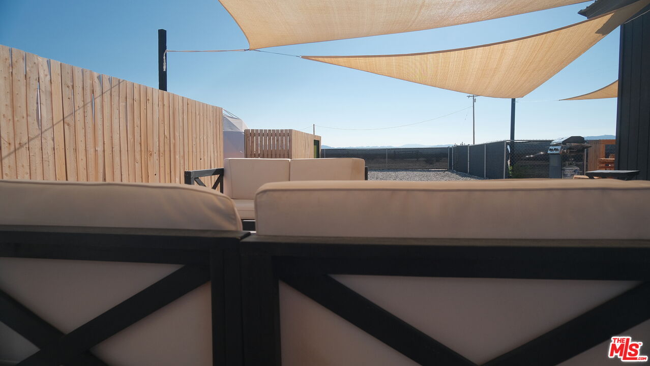 4351 Meriwether Road Twentynine Palms, CA 92277 - Photo 8 of 28 a terrace with a table and chairs