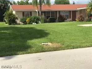 a view of a house with a garden