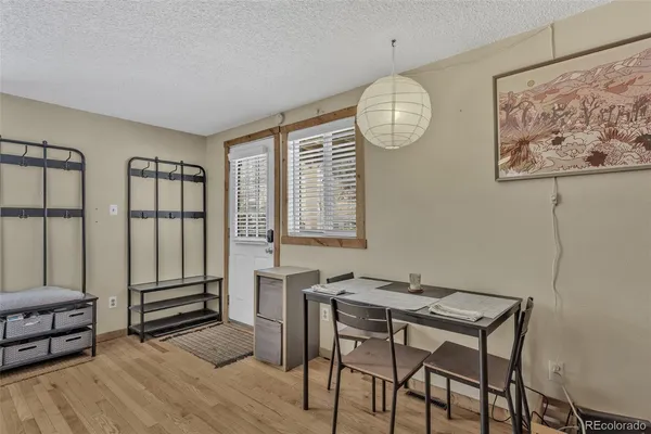 a view of a livingroom with furniture and wooden floor