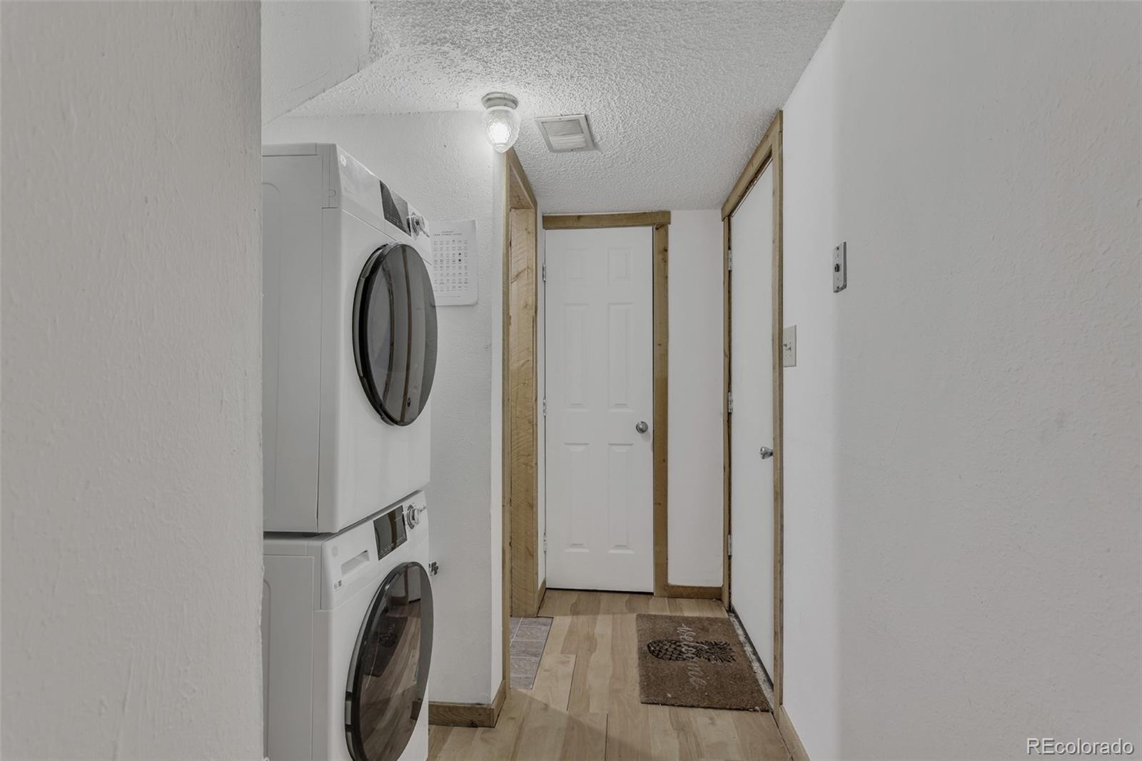 1450 Marion Street Georgetown, CO 80444 - Photo 13 of 25 a view of a hallway with washer and dryer