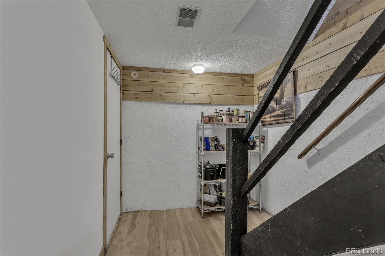 1450 Marion Street Georgetown, CO 80444 - Photo 14 of 25 a view of entryway with stairs and wooden floor