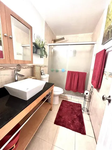 a bathroom with a bathtub and a sink