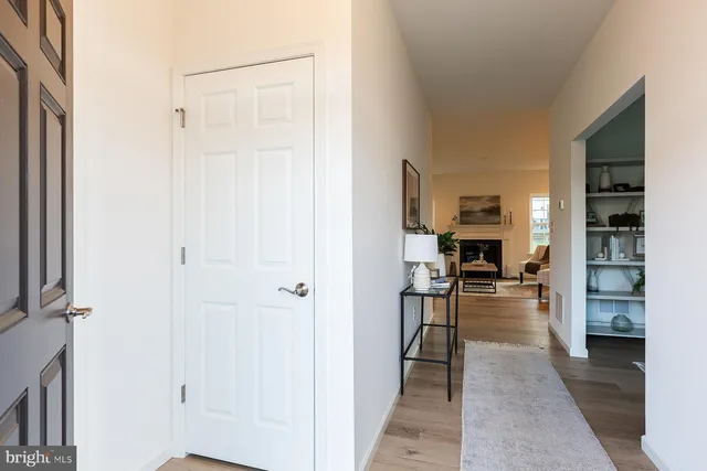 a living room with furniture fireplace and window