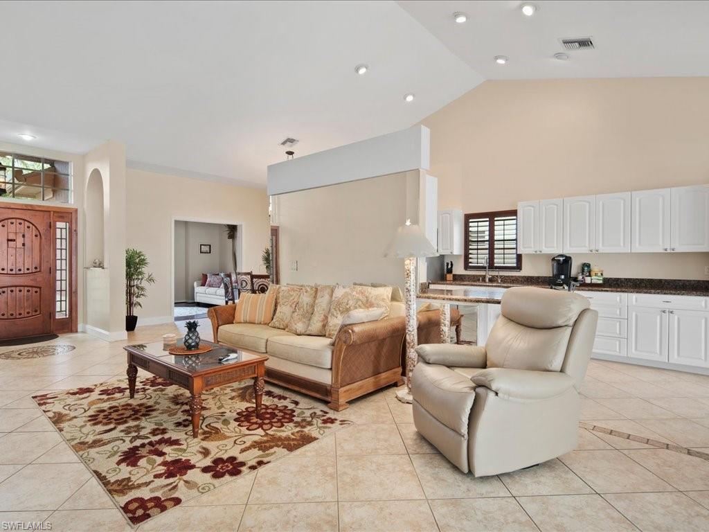 2088 Piccadilly Circus Naples, FL 34112 - Photo 11 of 29 a living room with furniture and wooden floor