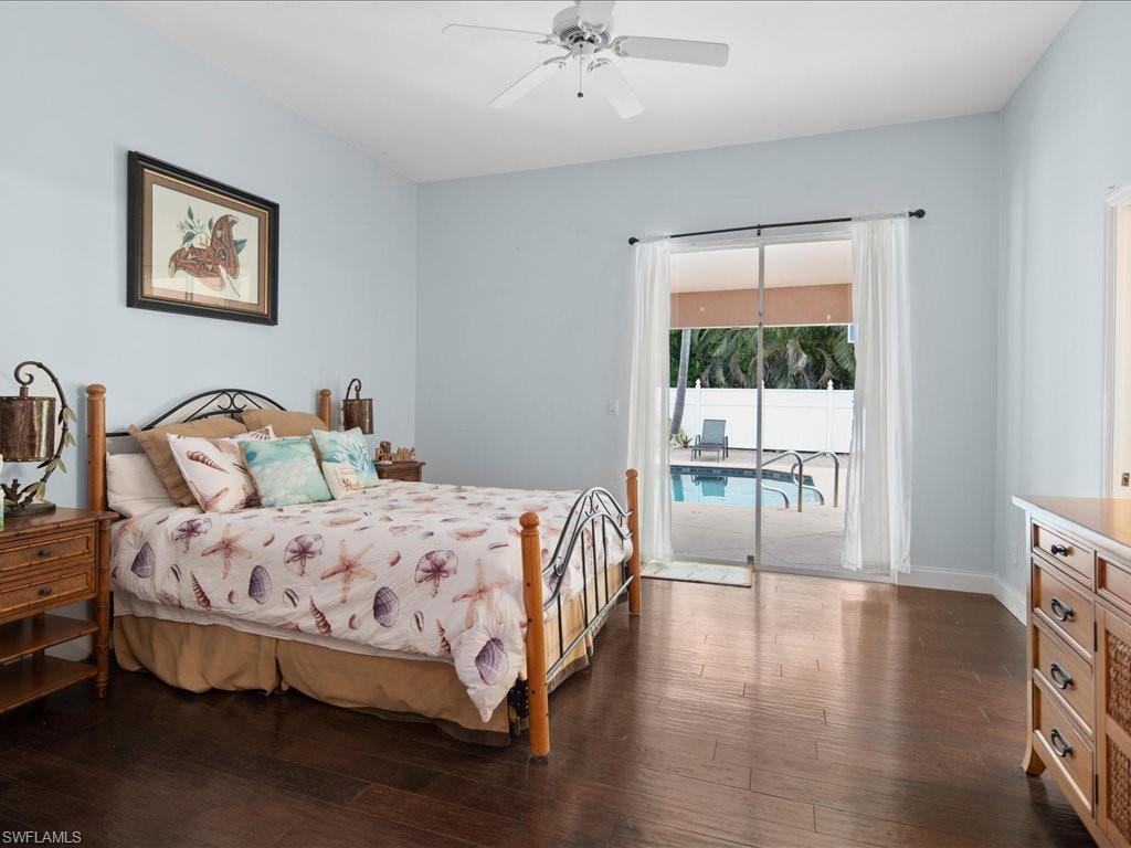 2088 Piccadilly Circus Naples, FL 34112 - Photo 12 of 29 a bedroom with a bed a couch and a window
