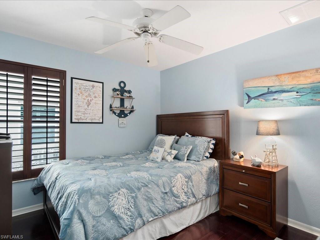 2088 Piccadilly Circus Naples, FL 34112 - Photo 15 of 29 a bedroom with a bed and a window
