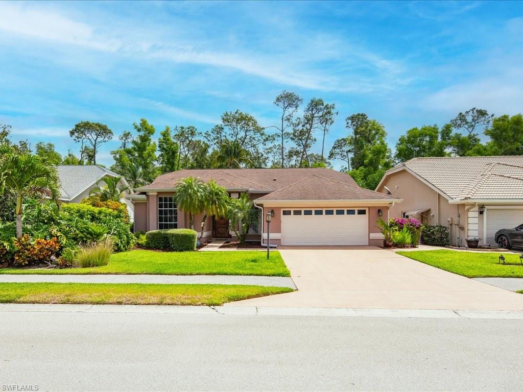 2088 Piccadilly Circus Naples, FL 34112 - Photo 2 of 29 a view of a house with a big yard