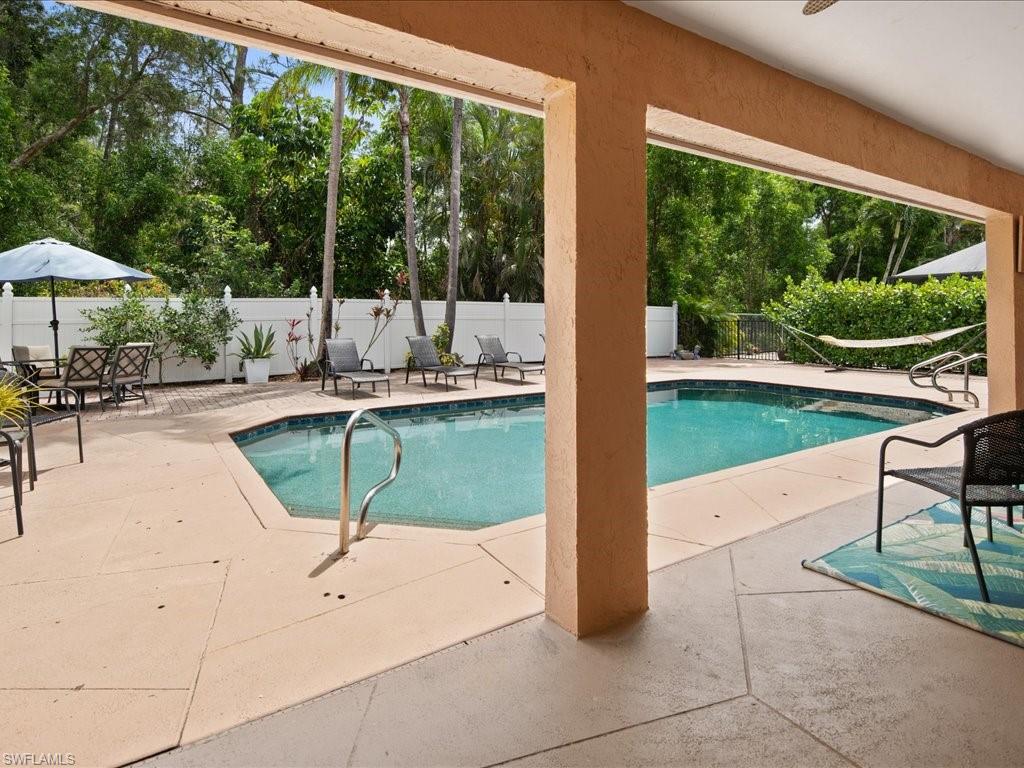 2088 Piccadilly Circus Naples, FL 34112 - Photo 23 of 29 a swimming pool with outdoor seating and yard