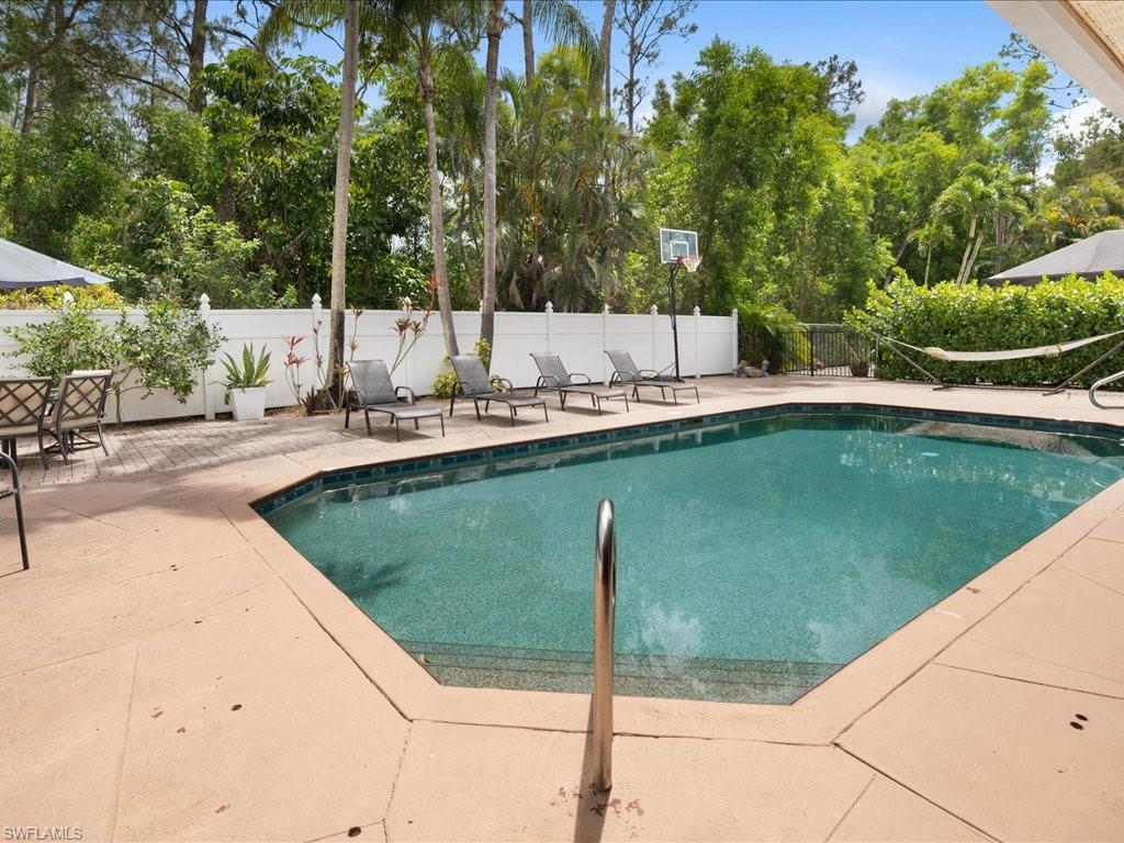 2088 Piccadilly Circus Naples, FL 34112 - Photo 24 of 29 a swimming pool with outdoor seating and yard