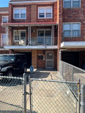 a front view of a house with parking space