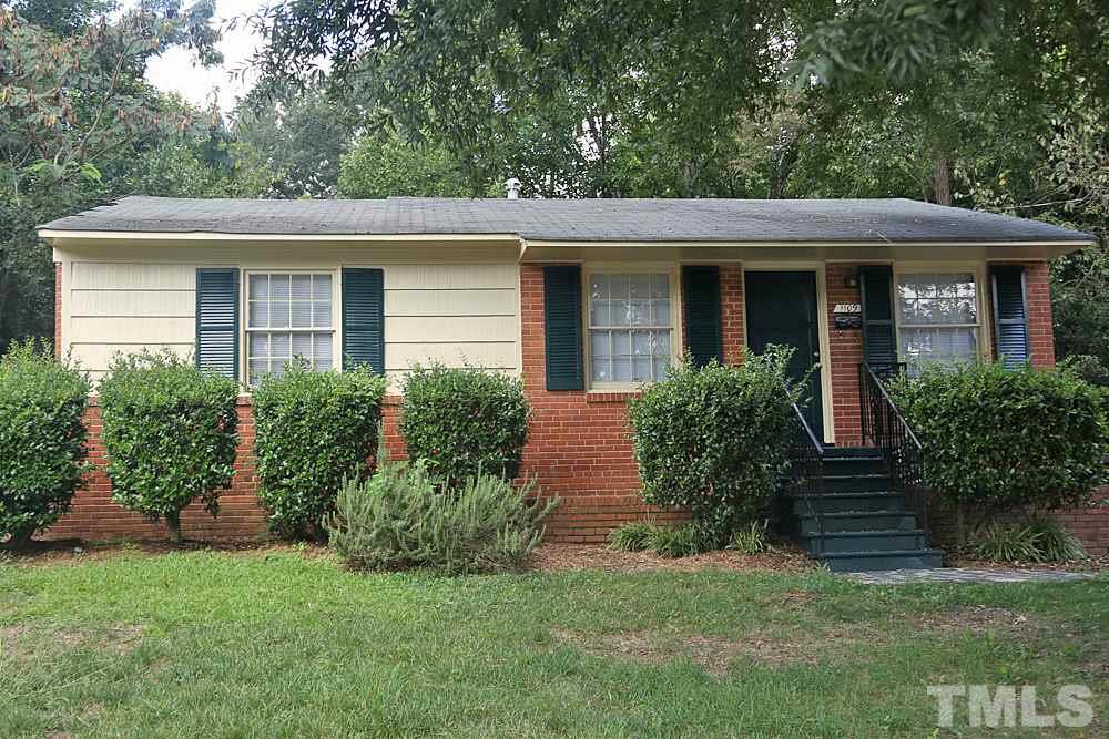 1109 North King Charles Road Raleigh, NC 27610 - Photo 1 of 13 a front view of a house with garden