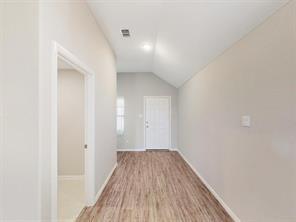 3421 Buster Way Corinth, TX 76210 - Photo 4 of 11 a view of a hallway with wooden floor