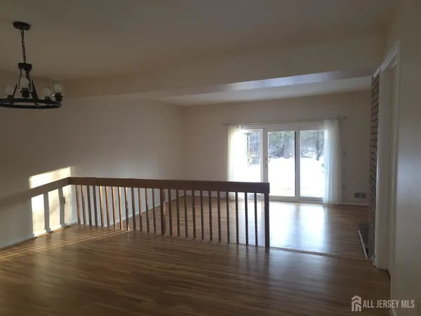 a view of hallway with wooden floor