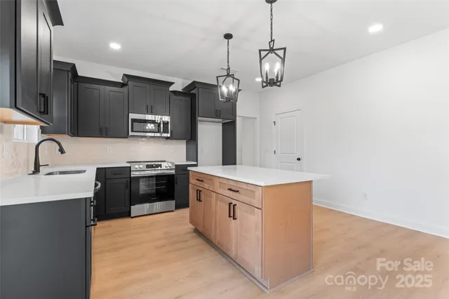 a kitchen with a stove and a sink