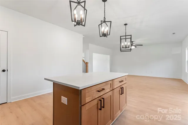 a kitchen with stainless steel appliances a white stove top oven and a chimney
