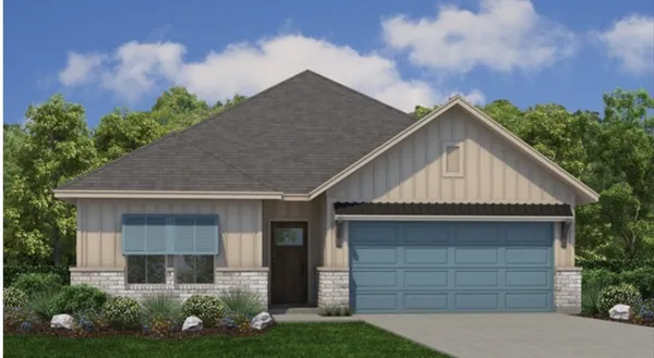 a front view of a house with a garden and plants