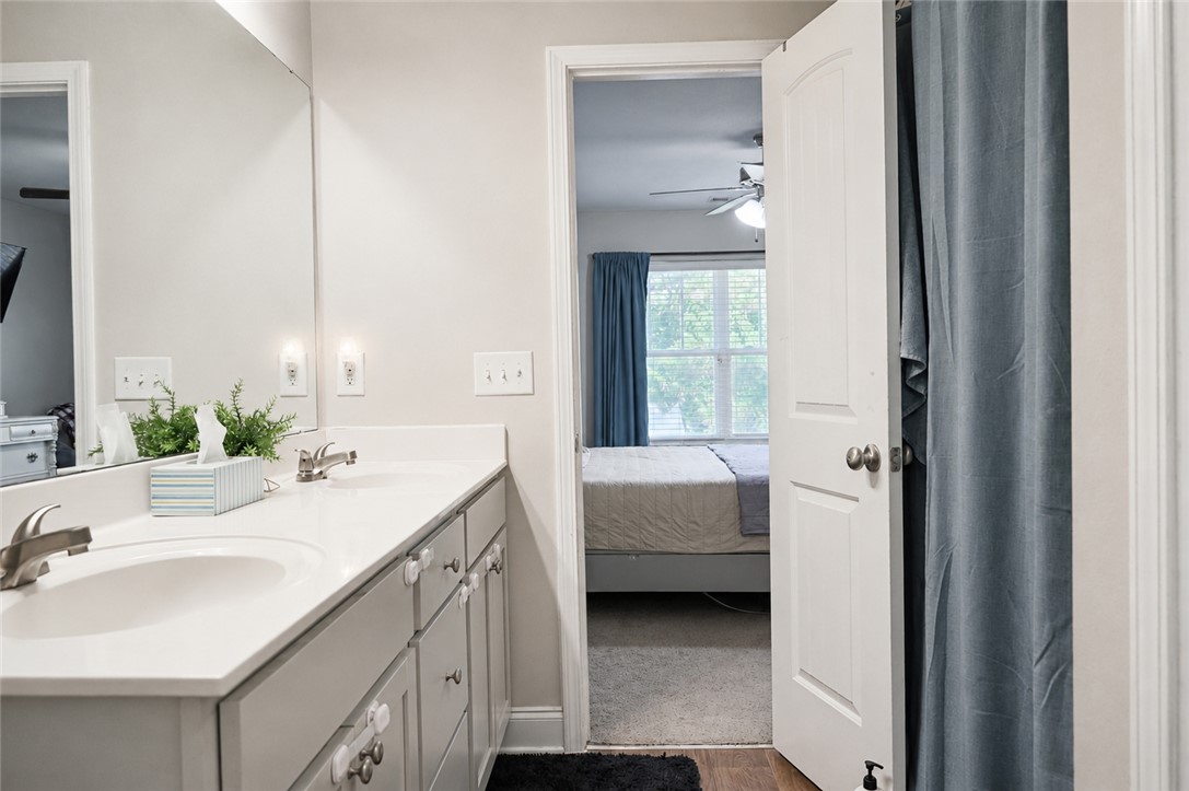 102 Ventura Street Anderson, SC 29621 - Photo 15 of 24 Double vanity sinks and bright mirrors create a functional and well-lit bathing space.
