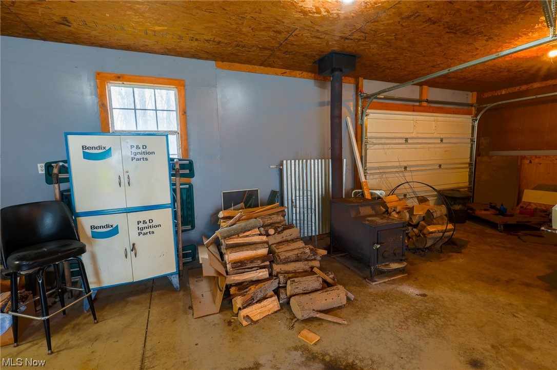 533 Middle Road Conneaut, OH 44030 - Photo 44 of 46 Garage featuring a wood stove