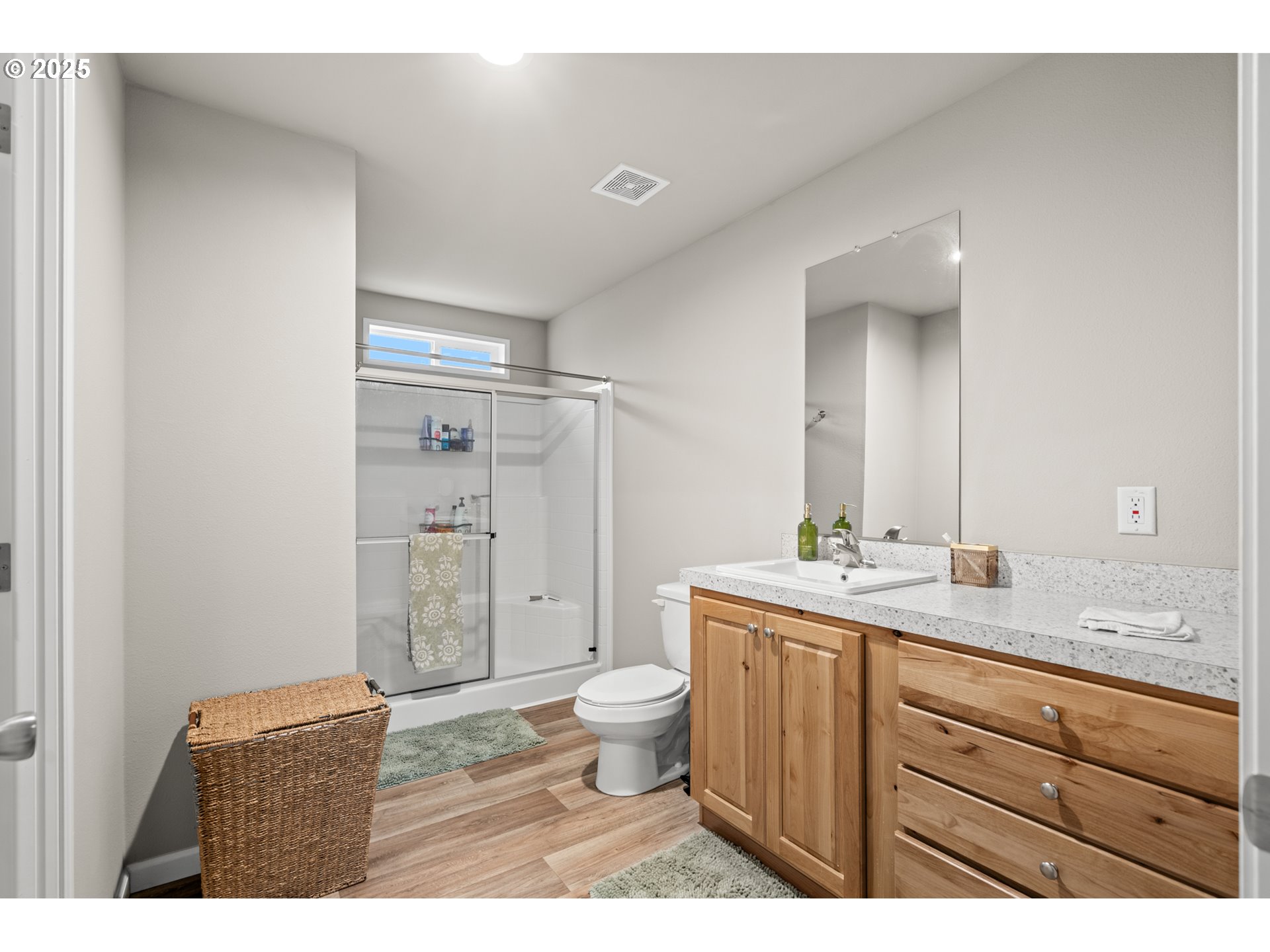 32390 East Punkin Center Road Hermiston, OR 97838 - Photo 13 of 17 a bathroom with a granite countertop sink toilet mirror and shower