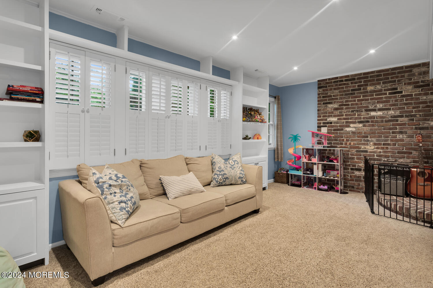 162 Twin Brooks Avenue Middletown, NJ 07748 - Photo 20 of 60 a living room with furniture and a fireplace