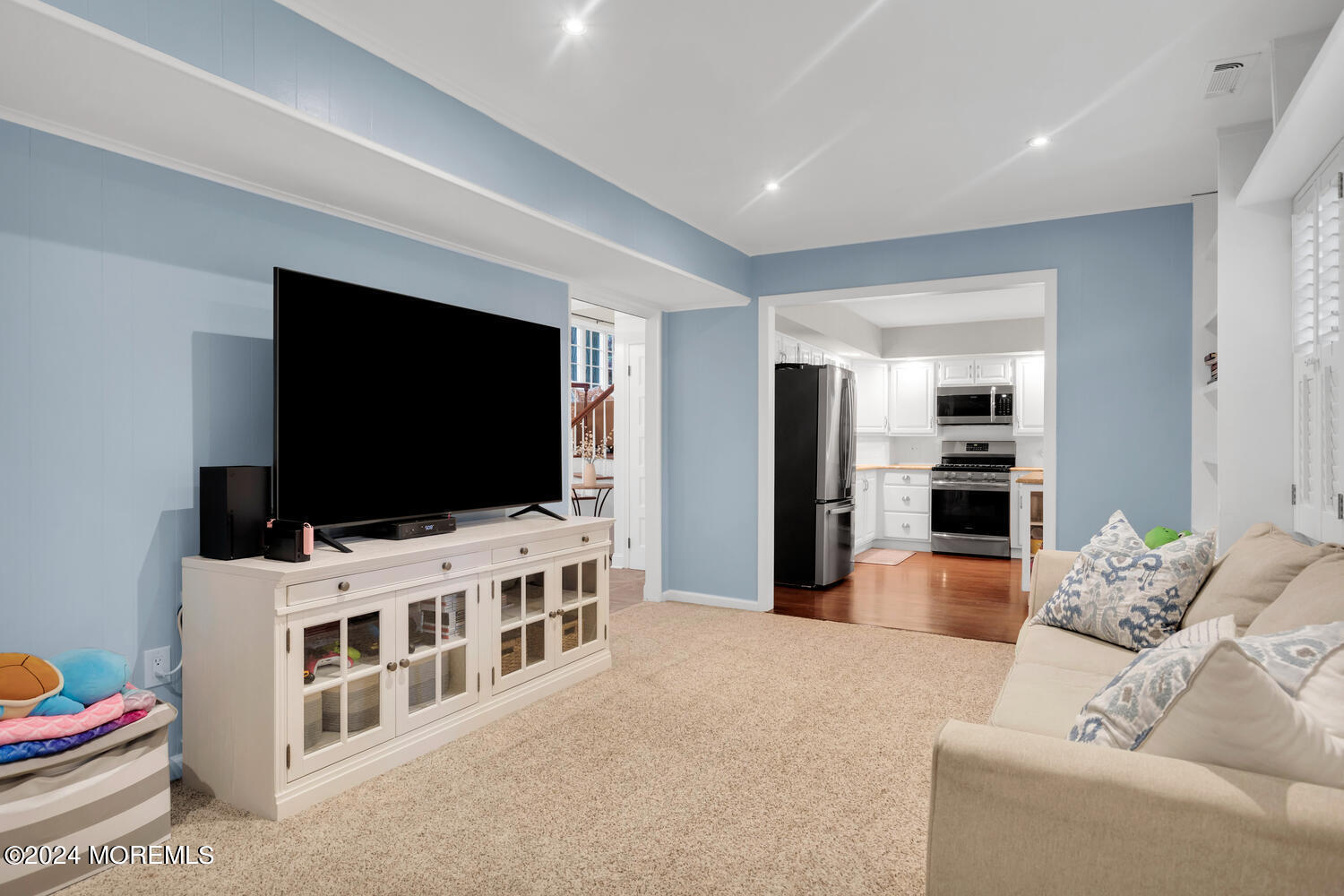 162 Twin Brooks Avenue Middletown, NJ 07748 - Photo 22 of 60 a living room with furniture and a flat screen tv