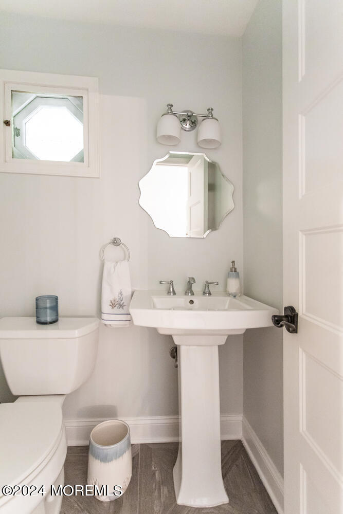 162 Twin Brooks Avenue Middletown, NJ 07748 - Photo 23 of 60 a bathroom with a sink toilet and mirror
