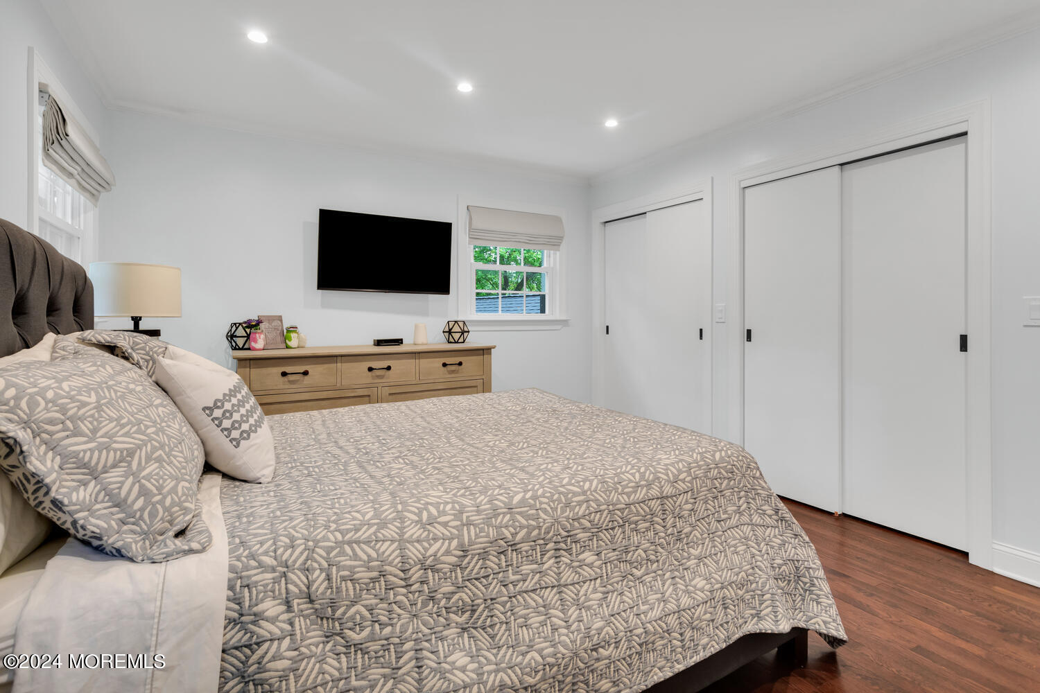 162 Twin Brooks Avenue Middletown, NJ 07748 - Photo 32 of 60 a bedroom with a bed and flat screen tv