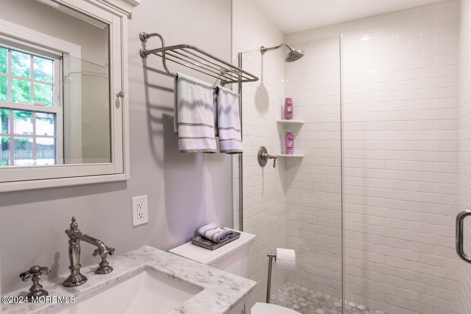 162 Twin Brooks Avenue Middletown, NJ 07748 - Photo 34 of 60 a bathroom with a sink mirror and shower