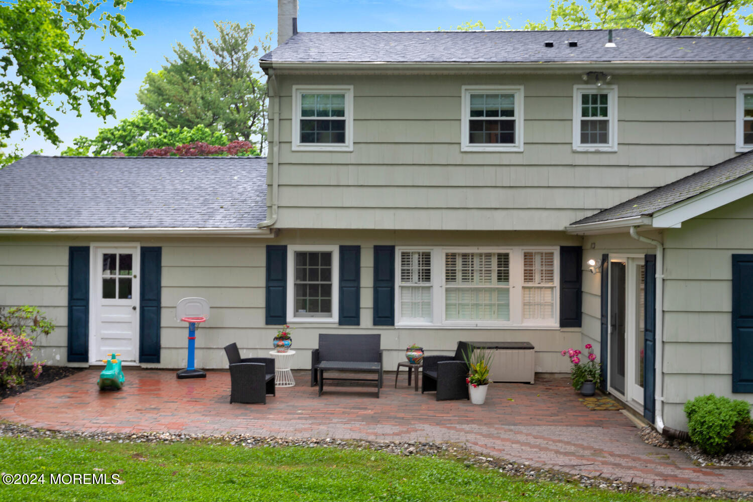 162 Twin Brooks Avenue Middletown, NJ 07748 - Photo 46 of 60 a view of a house with a patio and a yard