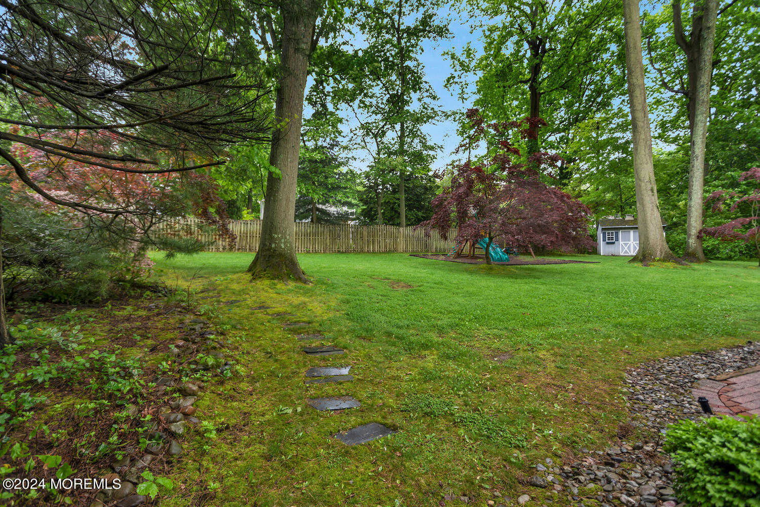 162 Twin Brooks Avenue Middletown, NJ 07748 - Photo 49 of 60 a view of a backyard with large trees