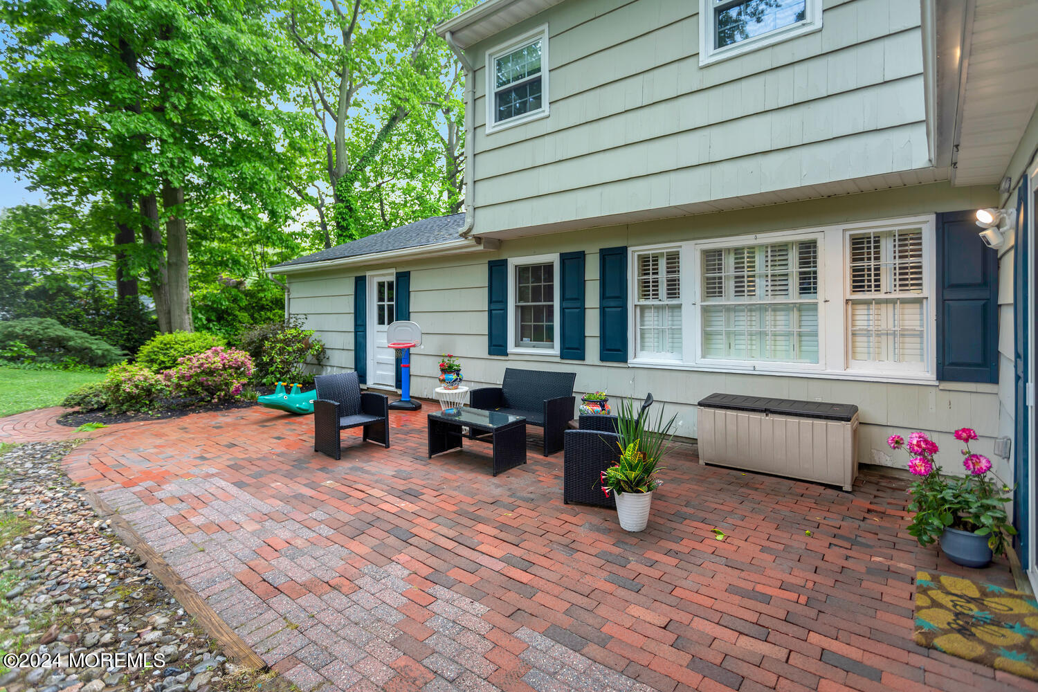 162 Twin Brooks Avenue Middletown, NJ 07748 - Photo 57 of 60 a view of a house with sitting area and garden