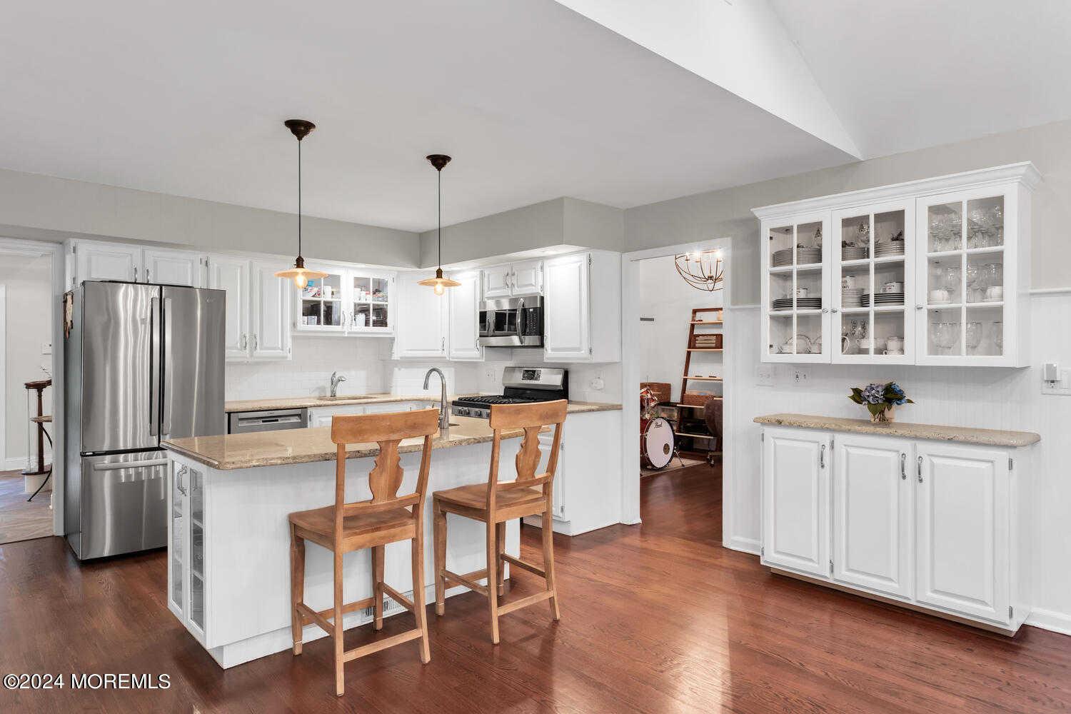 162 Twin Brooks Avenue Middletown, NJ 07748 - Photo 10 of 60 a kitchen with stainless steel appliances granite countertop a refrigerator a stove top oven a sink dishwasher and white cabinets with wooden floor