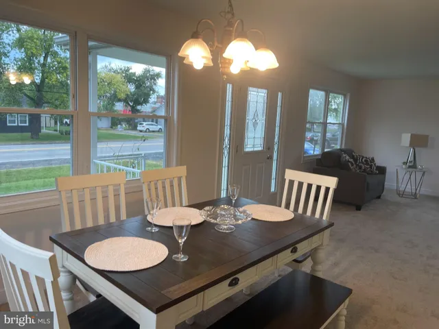 a view of a dining room with furniture window and outside view
