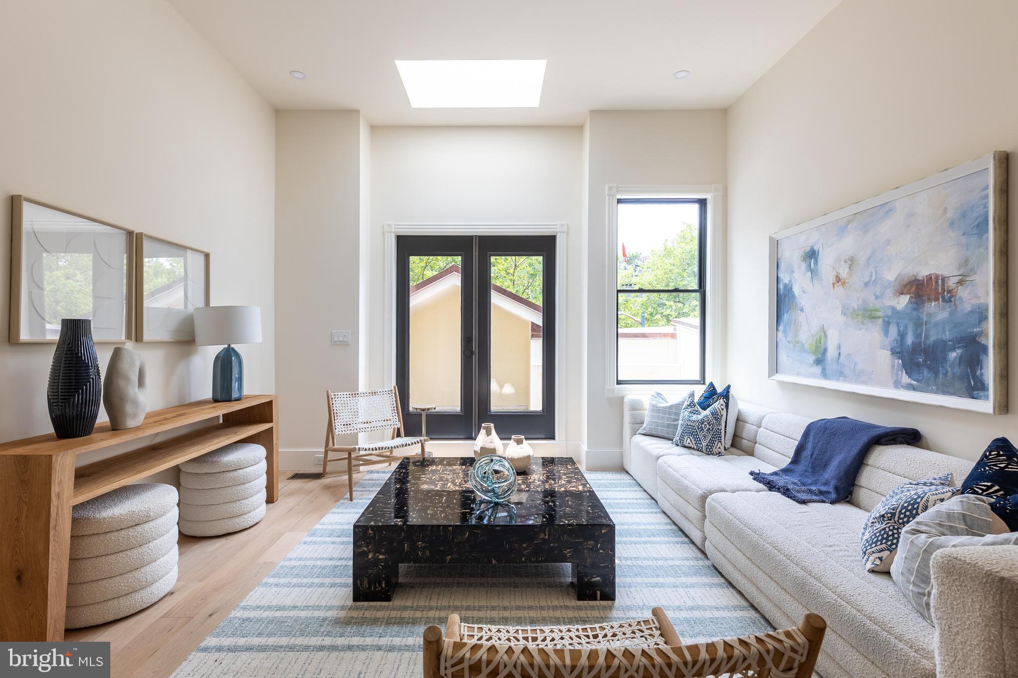 441 Q Street Northwest, Unit PH Washington, DC 20001 - Photo 13 of 55 a living room with furniture and a large window