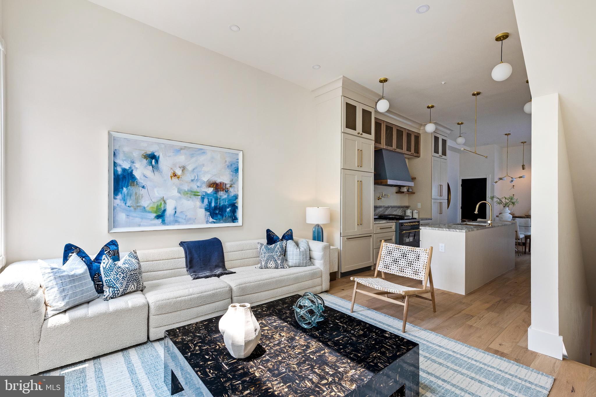 441 Q Street Northwest, Unit PH Washington, DC 20001 - Photo 14 of 55 a living room with furniture and a couch