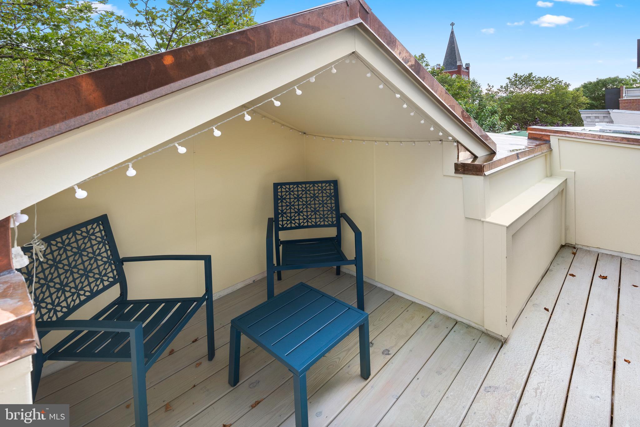 441 Q Street Northwest, Unit PH Washington, DC 20001 - Photo 18 of 55 a balcony with wooden floor and outdoor seating