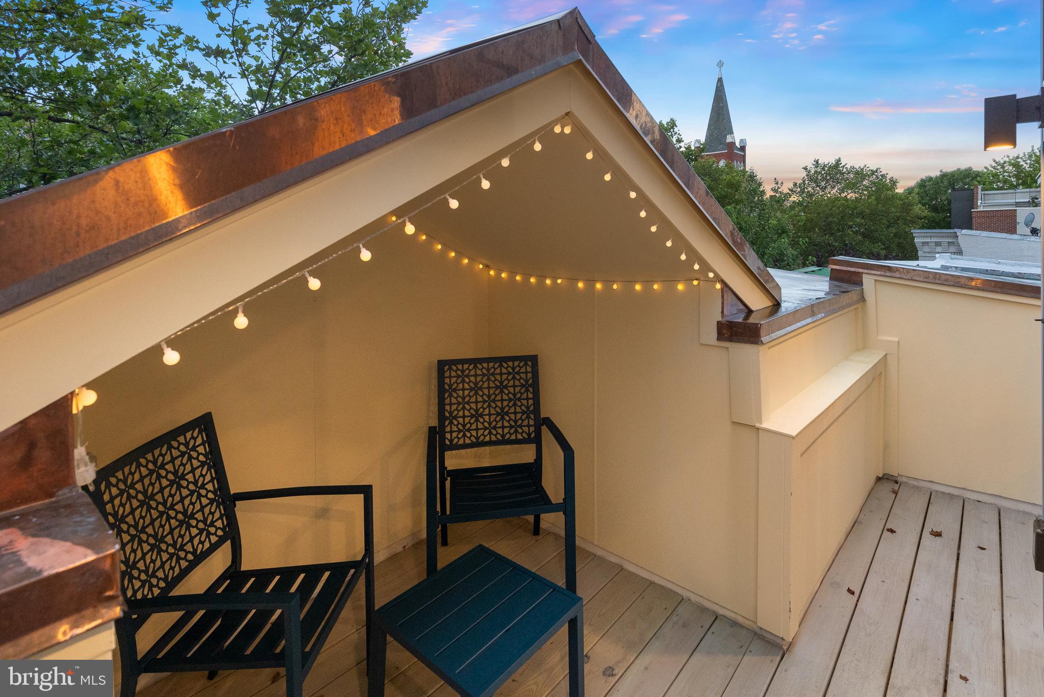 441 Q Street Northwest, Unit PH Washington, DC 20001 - Photo 20 of 55 a terrace of a house with wooden floor and outdoor seating
