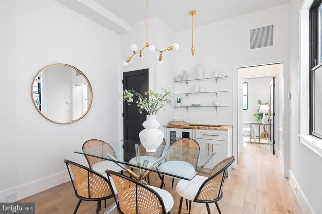a bedroom with a bed and glass window