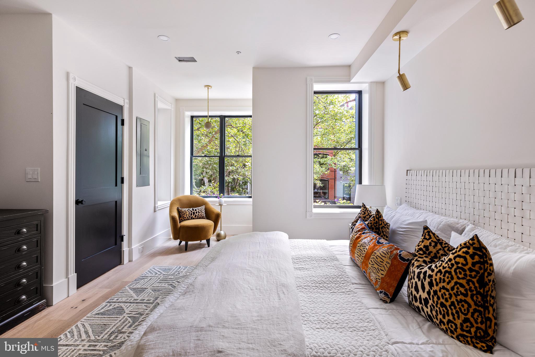 441 Q Street Northwest, Unit PH Washington, DC 20001 - Photo 25 of 55 a bedroom with a bed and a couch