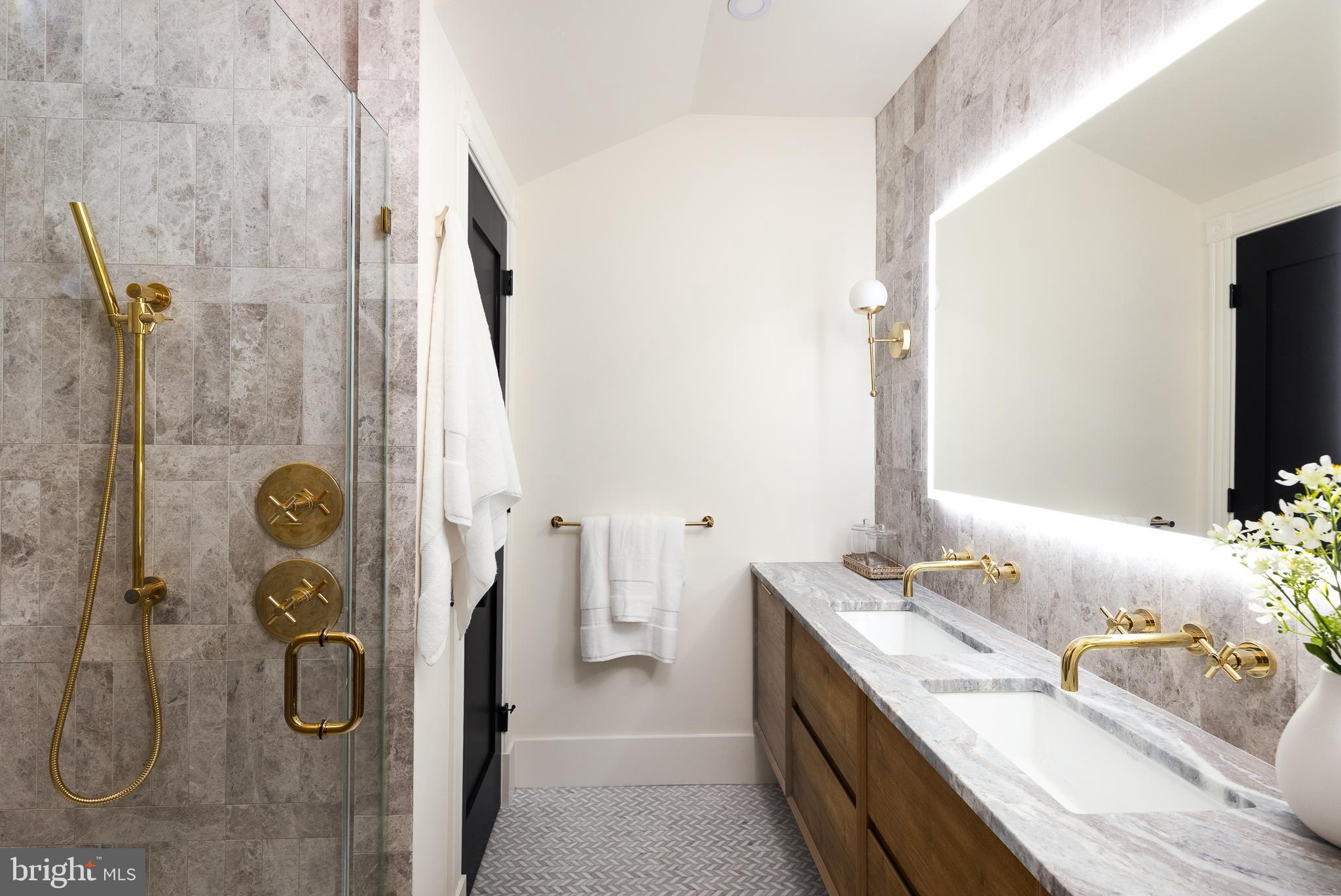 441 Q Street Northwest, Unit PH Washington, DC 20001 - Photo 29 of 55 a bathroom with a granite countertop sink and a mirror
