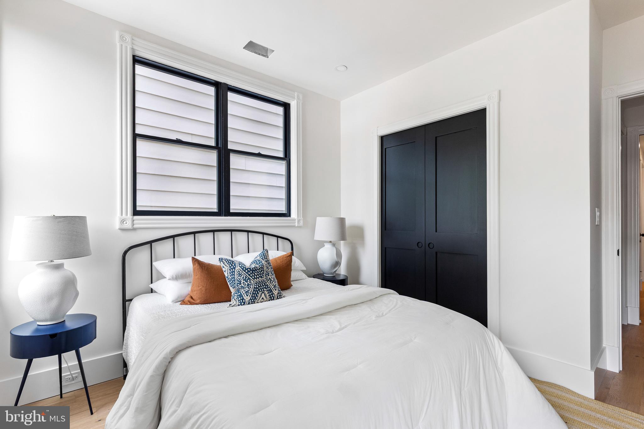 441 Q Street Northwest, Unit PH Washington, DC 20001 - Photo 32 of 55 a bedroom with a bed and a window