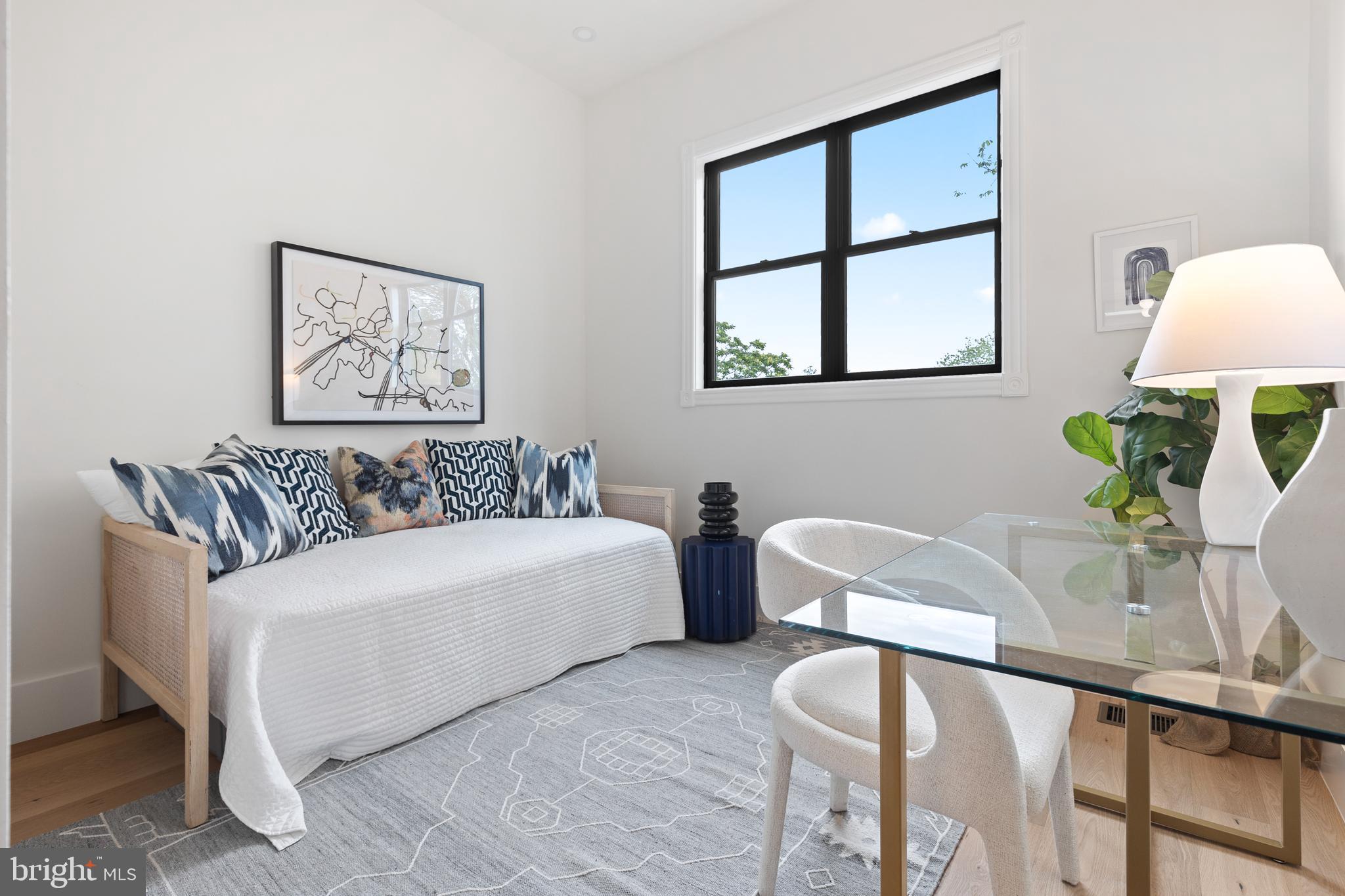 441 Q Street Northwest, Unit PH Washington, DC 20001 - Photo 36 of 55 a living room with furniture a lamp and a potted plant