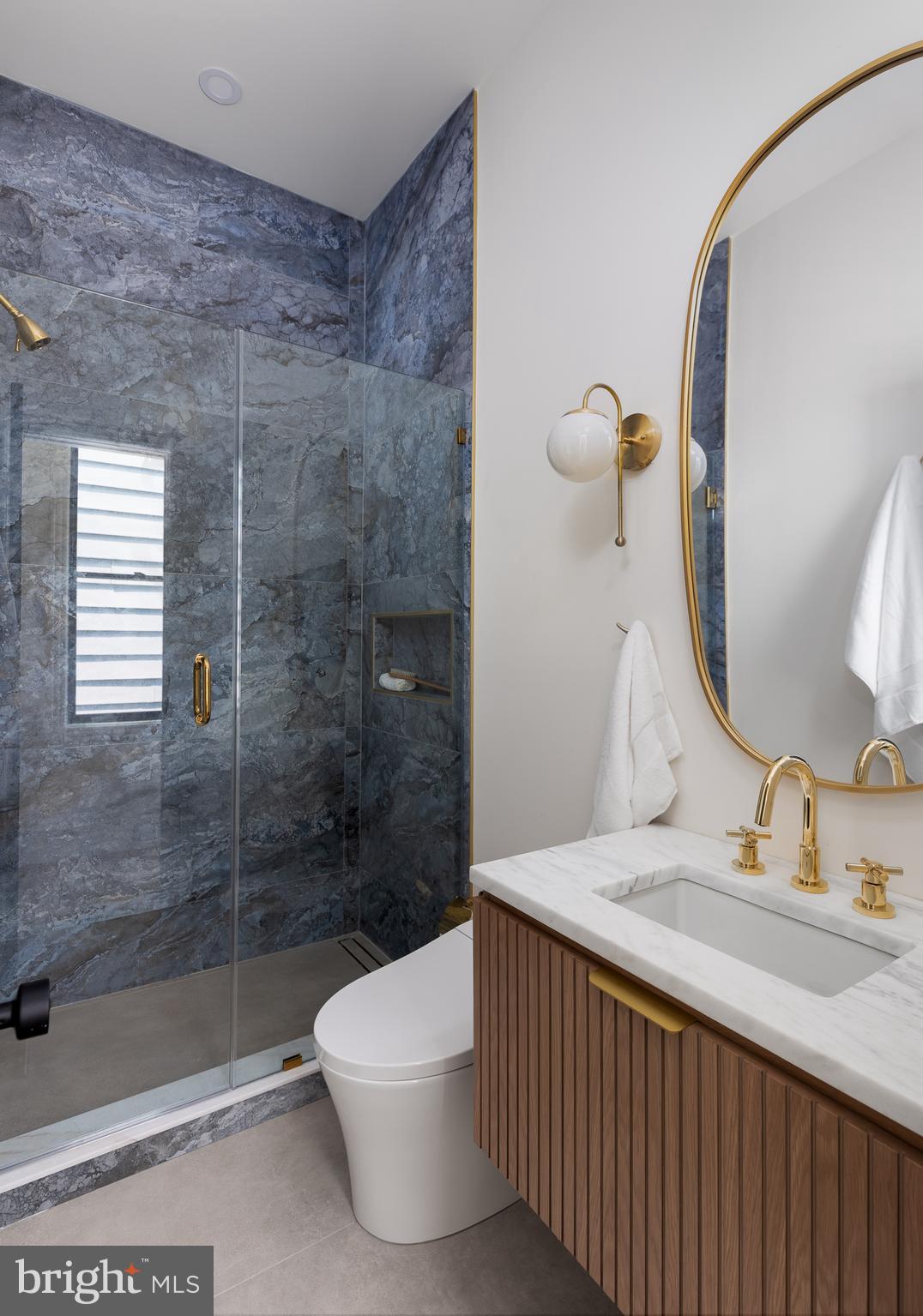 441 Q Street Northwest, Unit PH Washington, DC 20001 - Photo 37 of 55 a bathroom with a sink and a mirror