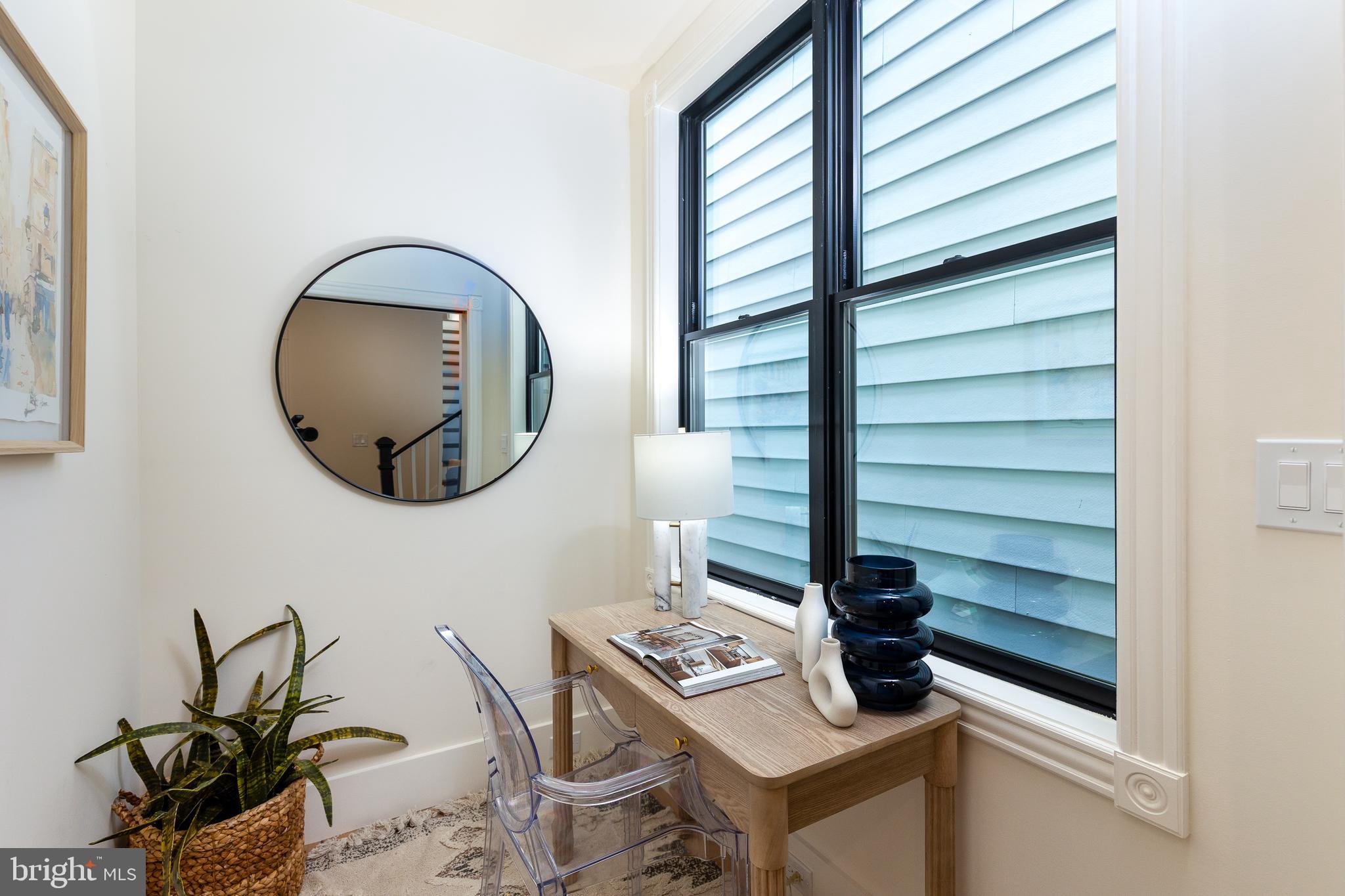 441 Q Street Northwest, Unit PH Washington, DC 20001 - Photo 38 of 55 a bathroom with a toilet a sink and a mirror