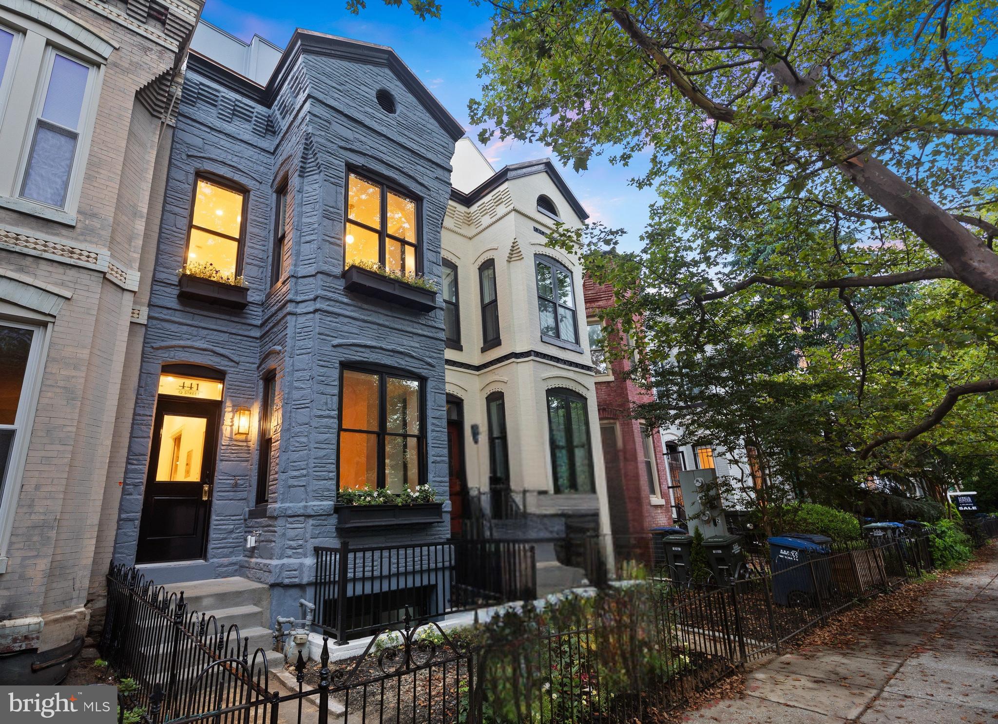 441 Q Street Northwest, Unit PH Washington, DC 20001 - Photo 40 of 55 a front view of a residential apartment building with a tree